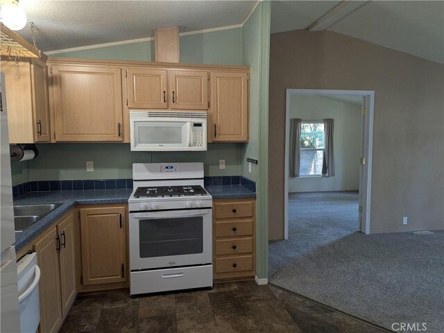16121 Golf Rd, Cobb, CA 95426 - kitchen featuring white appliances, lofted ceiling, dark countertops, light brown cabinetry, and crown molding