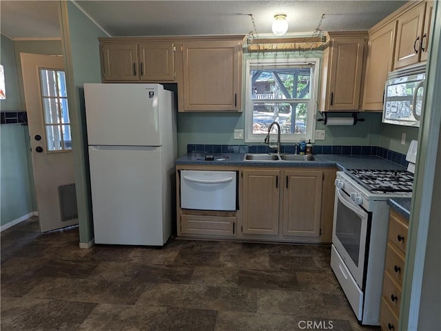 16121 Golf Rd, Cobb, CA 95426 - kitchen with white appliances, dark countertops, ornamental molding, stone finish floors, and light brown cabinets