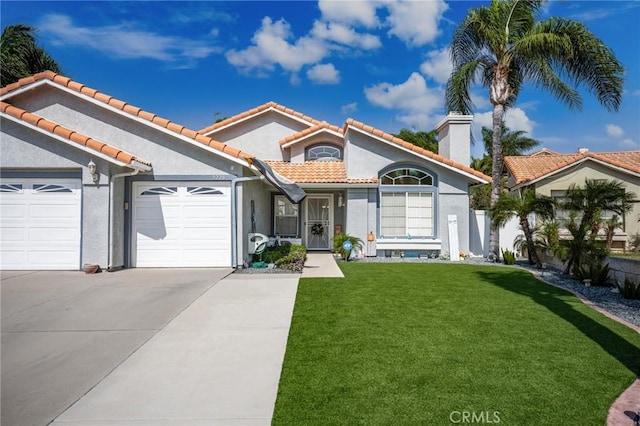 9228 Whiting Way, Riverside, CA 92508 - mediterranean / spanish house featuring concrete driveway, stucco siding, a front yard, and a chimney