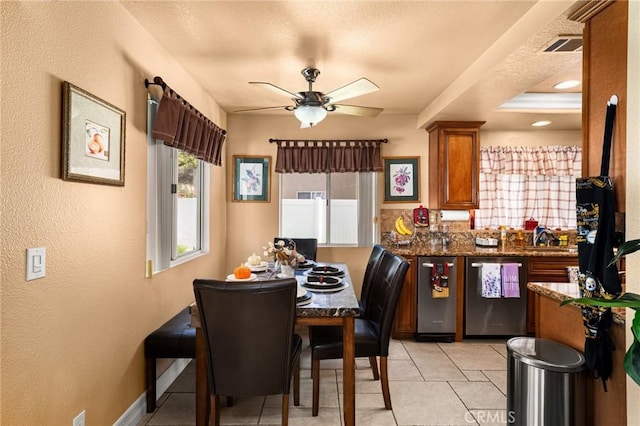 9228 Whiting Way, Riverside, CA 92508 - dining space with plenty of natural light, a ceiling fan, a textured wall, and light tile patterned floors