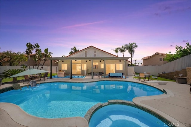 9228 Whiting Way, Riverside, CA 92508 - view of pool featuring a pool with connected hot tub, a ceiling fan, a fenced backyard, and a patio