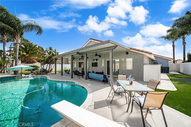 9228 Whiting Way, Riverside, CA 92508 - view of pool with ceiling fan, a fenced backyard, a patio area, and a diving board