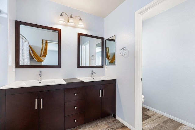 1527 Gold Run Rd, Chula Vista, CA 91913 - full bath featuring wood finished floors and double vanity