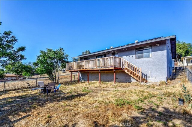 28521 Williams Dr, Menifee, CA 92587 - rear view of house with a deck, stairway, and stucco siding