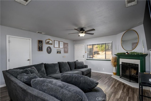 28521 Williams Dr, Menifee, CA 92587 - living area with a fireplace with raised hearth, ceiling fan, and dark wood finished floors