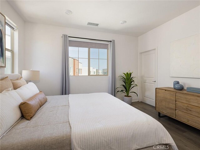 1673 Lexington Ln, San Pedro, CA 90732 - bedroom featuring dark wood-style floors and multiple windows