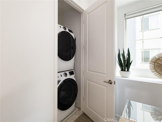 1673 Lexington Ln, San Pedro, CA 90732 - laundry area with stacked washer / drying machine and healthy amount of natural light