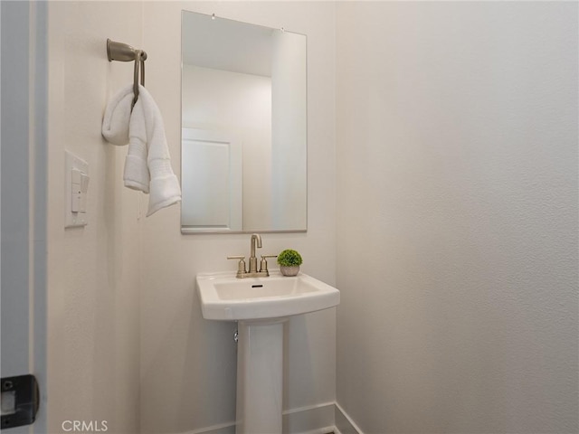 1673 Lexington Ln, San Pedro, CA 90732 - bathroom with baseboards and a sink