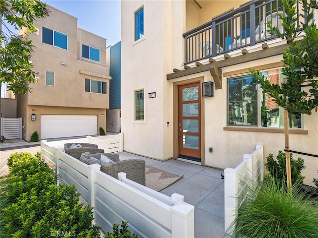 1673 Lexington Ln, San Pedro, CA 90732 - property entrance with a balcony, stucco siding, and a garage