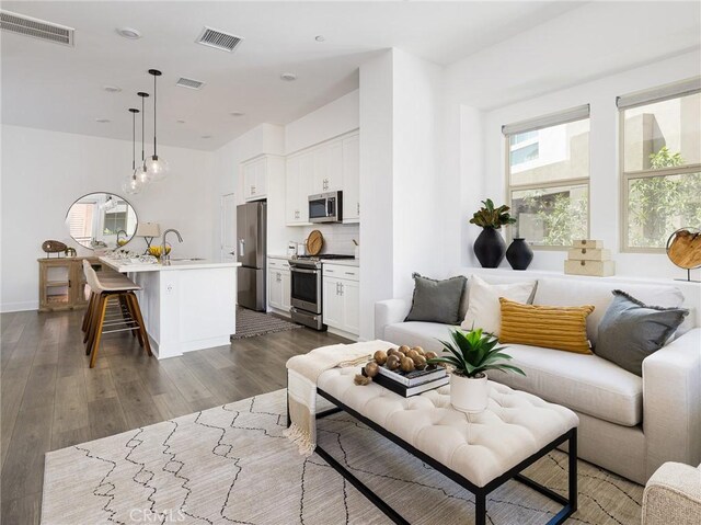 1673 Lexington Ln, San Pedro, CA 90732 - living room with dark wood-style flooring