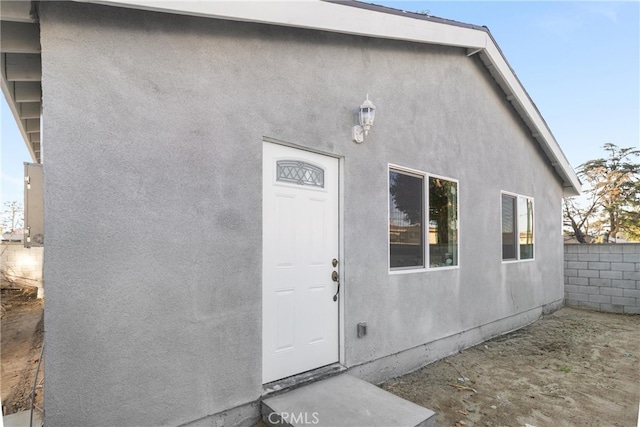 17055 San Bernardino Ave, Fontana, CA 92335 - doorway to property with stucco siding