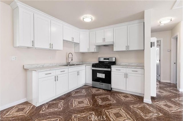 17055 San Bernardino Ave, Fontana, CA 92335 - kitchen with stainless steel gas range oven, under cabinet range hood, white cabinetry, and light stone countertops