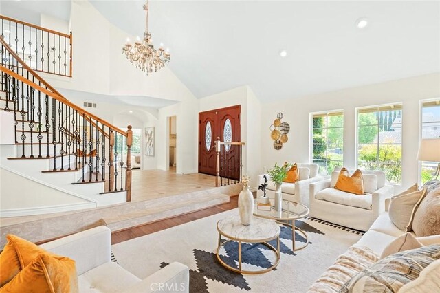 21557 Ambushers St, Diamond Bar, CA 91765 - living room featuring a chandelier, stairway, high vaulted ceiling, wood finished floors, and recessed lighting