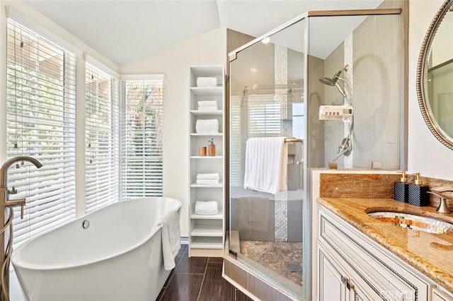 21557 Ambushers St, Diamond Bar, CA 91765 - bathroom with a stall shower, a freestanding tub, vanity, vaulted ceiling, and wood finished floors