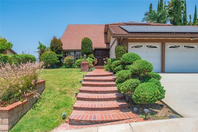 21557 Ambushers St, Diamond Bar, CA 91765 - view of front of home featuring roof mounted solar panels, a tiled roof, driveway, a front lawn, and an attached garage