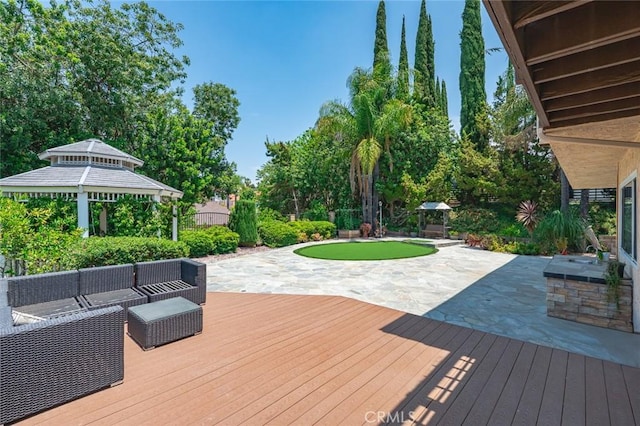 21557 Ambushers St, Diamond Bar, CA 91765 - wooden deck featuring a patio area, a gazebo, outdoor lounge area, a putting green, and view of wooded area