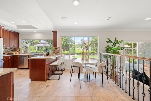 21557 Ambushers St, Diamond Bar, CA 91765 - kitchen featuring stainless steel appliances, a breakfast bar, backsplash, ornamental molding, and a peninsula