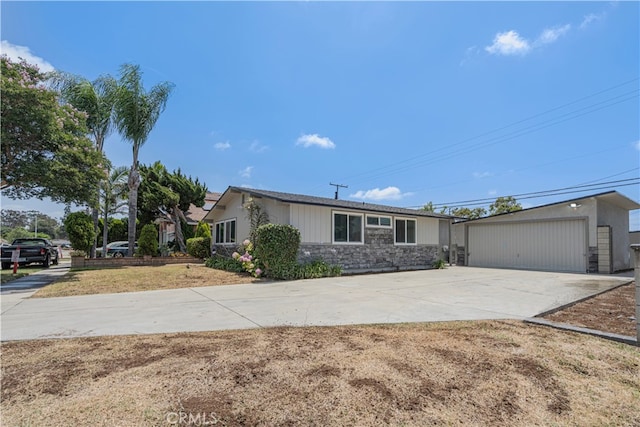 12302 Beaty Ave, Norwalk, CA 90650 - ranch-style house with stone siding and an outbuilding