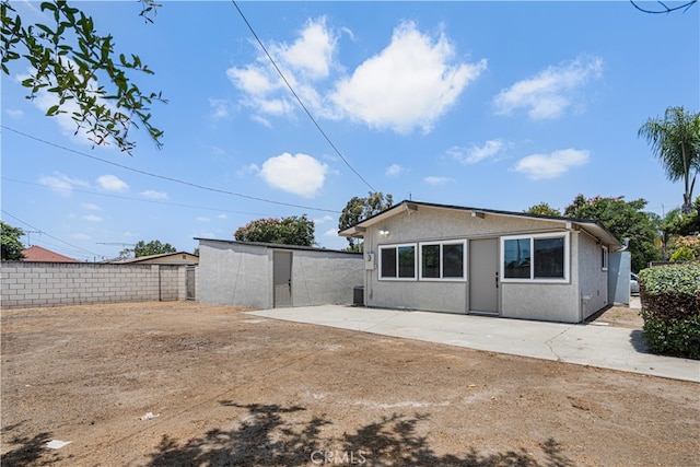 12302 Beaty Ave, Norwalk, CA 90650 - rear view of house featuring a patio and stucco siding