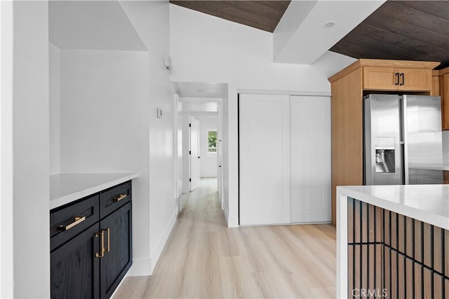 12302 Beaty Ave, Norwalk, CA 90650 - kitchen featuring light countertops, light wood finished floors, stainless steel fridge with ice dispenser, and wooden ceiling