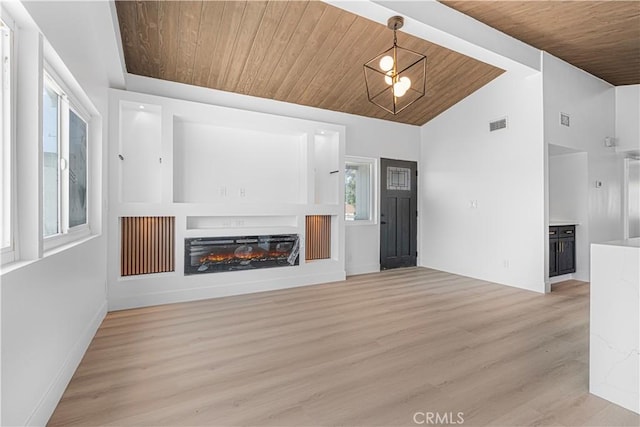 12302 Beaty Ave, Norwalk, CA 90650 - unfurnished living room featuring wooden ceiling, light wood-style floors, lofted ceiling, and a glass covered fireplace