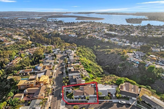 4704 Jumano Ave, San Diego, CA 92117 - aerial view of property's location with property boundaries highlighted, a large body of water, and nearby suburban area
