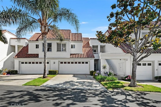 50 Los Cabos, Dana Point, CA 92629 - view of front of house featuring stucco siding, a tiled roof, driveway, and stairs