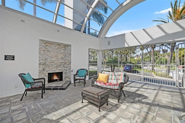 50 Los Cabos, Dana Point, CA 92629 - view of patio with an outdoor living space with a fireplace and glass enclosure