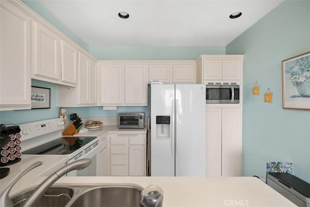 50 Los Cabos, Dana Point, CA 92629 - kitchen with white appliances, light countertops, and white cabinetry