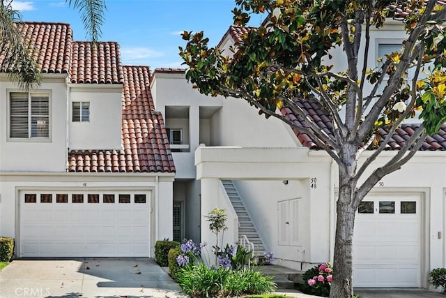 50 Los Cabos, Dana Point, CA 92629 - mediterranean / spanish house with a tiled roof, driveway, stucco siding, and an attached garage