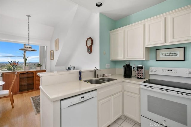 50 Los Cabos, Dana Point, CA 92629 - kitchen featuring white appliances, a peninsula, white cabinets, hanging light fixtures, and light countertops
