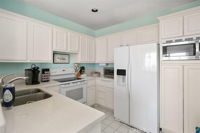 50 Los Cabos, Dana Point, CA 92629 - kitchen with white appliances, light countertops, light tile patterned flooring, and white cabinetry