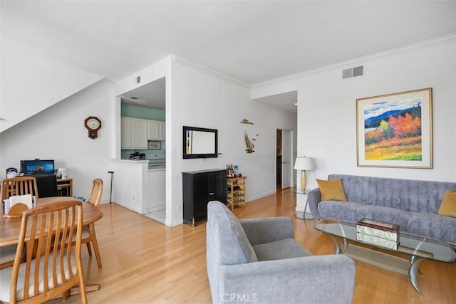 50 Los Cabos, Dana Point, CA 92629 - living room featuring light wood-style flooring and crown molding