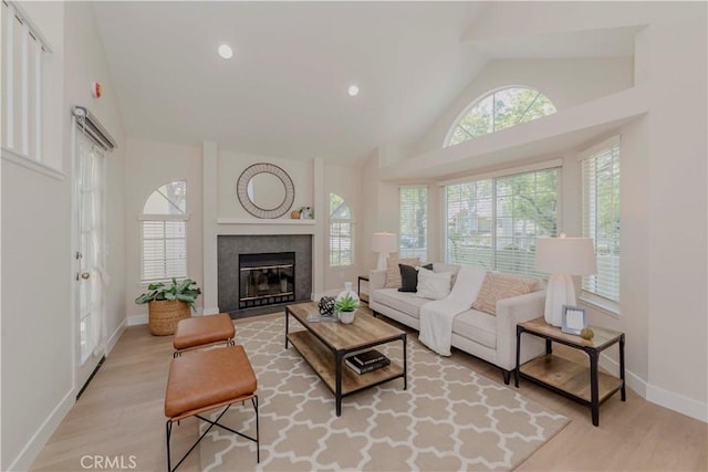 20759 E Crest Ln Unit B, Walnut, CA 91789 - living room with wood finished floors, a tile fireplace, high vaulted ceiling, and recessed lighting