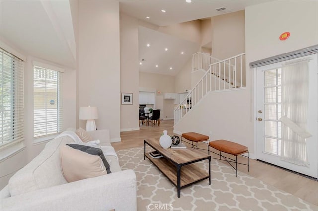 20759 E Crest Ln Unit B, Walnut, CA 91789 - living area with high vaulted ceiling, stairs, wood finished floors, and recessed lighting