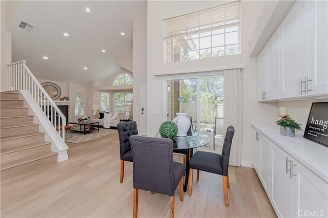 20759 E Crest Ln Unit B, Walnut, CA 91789 - dining area with high vaulted ceiling, stairs, light wood finished floors, and recessed lighting