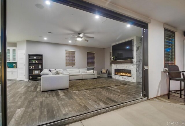 2184 Pacific Crest Dr, Alpine, CA 91901 - living room with a large fireplace, a ceiling fan, and wood finished floors
