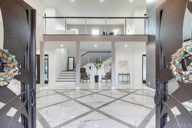 2184 Pacific Crest Dr, Alpine, CA 91901 - entrance foyer featuring marble tiled floors, a high ceiling, and stairway