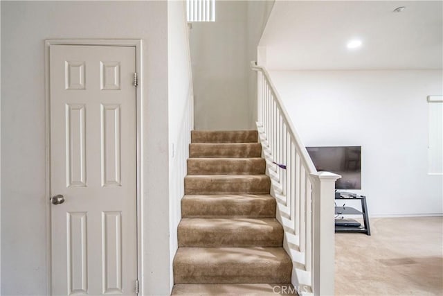 6257 Long Cove Dr, Fontana, CA 92336 - staircase featuring carpet floors