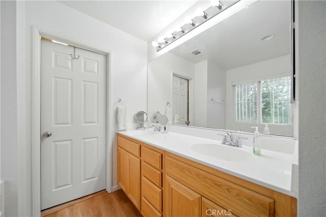 6257 Long Cove Dr, Fontana, CA 92336 - full bath with double vanity and wood finished floors