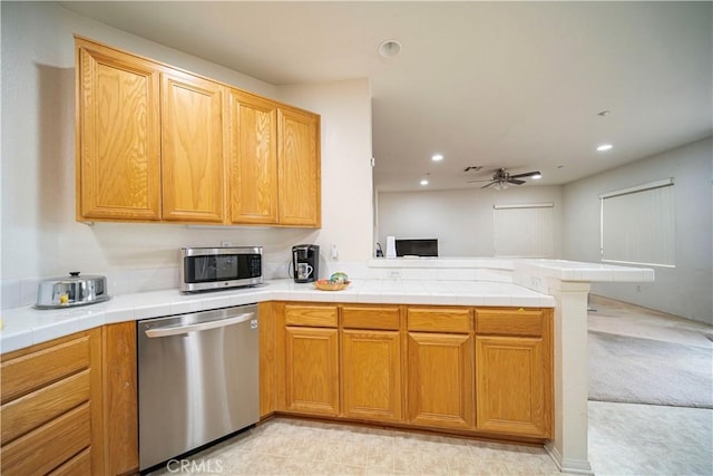6257 Long Cove Dr, Fontana, CA 92336 - kitchen with stainless steel appliances, a peninsula, a ceiling fan, recessed lighting, and open floor plan