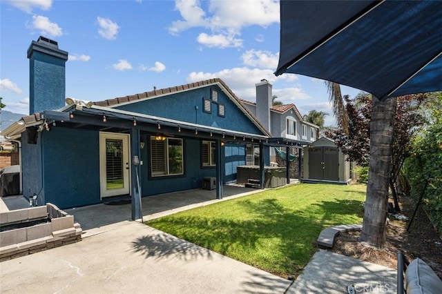 11901 Ardmoor Ct, Rancho Cucamonga, CA 91739 - rear view of property with a shed, a chimney, a hot tub, and a patio
