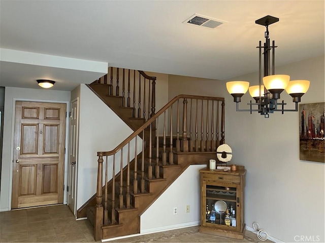 14422 Pimlico Rd, Westminster, CA 92683 - stairway with a chandelier and tile patterned flooring