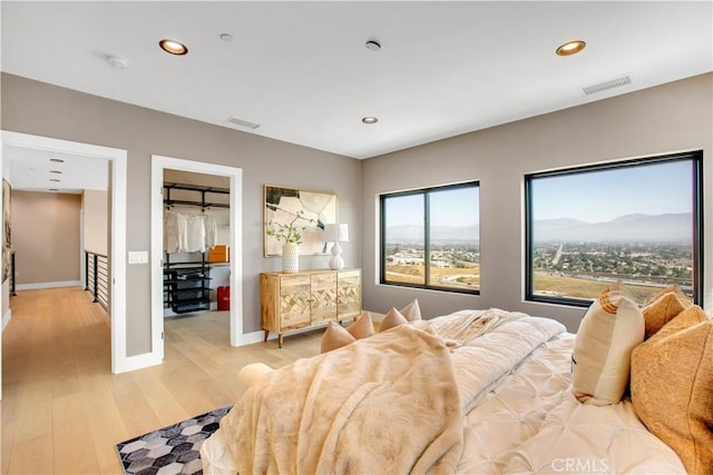 2380 Scenic Ridge Dr, Chino Hills, CA 91709 - bedroom featuring recessed lighting, light wood-style floors, and a spacious closet