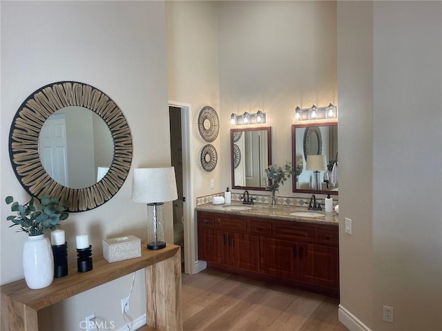 28652 Bridge Water Ln, Menifee, CA 92584 - full bath with wood finished floors and double vanity