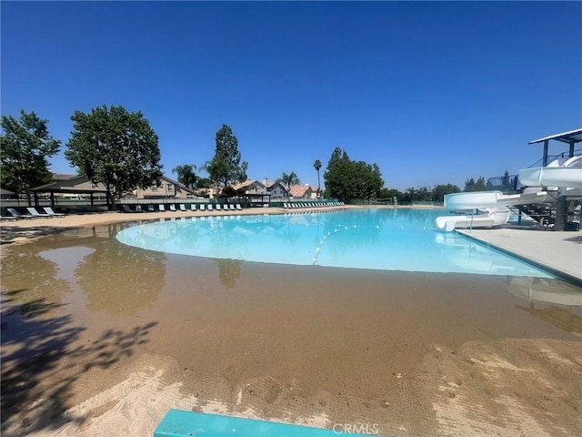 28652 Bridge Water Ln, Menifee, CA 92584 - community pool featuring a water slide and a grill