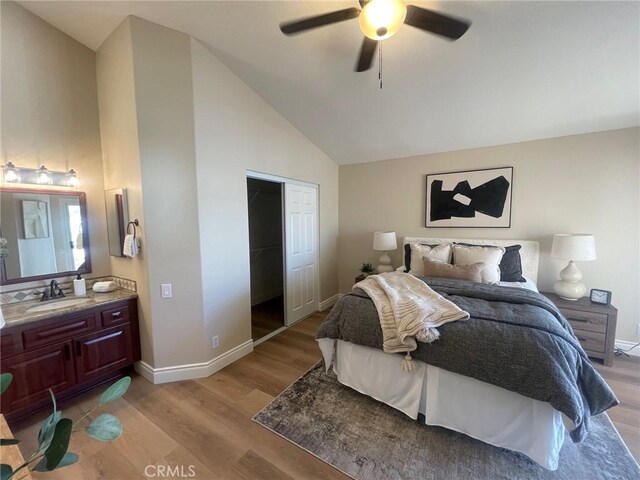 28652 Bridge Water Ln, Menifee, CA 92584 - bedroom with light wood-style flooring, high vaulted ceiling, ceiling fan, and a closet