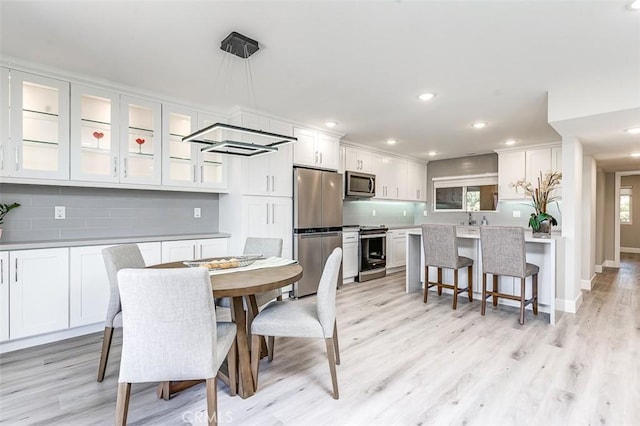4014 Calle Sonora Oeste Unit 2B, Laguna Woods, CA 92637 - dining area with light wood-style flooring and recessed lighting