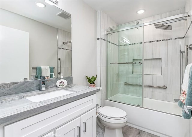 4014 Calle Sonora Oeste Unit 2B, Laguna Woods, CA 92637 - bathroom featuring vanity, shower / bath combination with glass door, wood finished floors, and recessed lighting