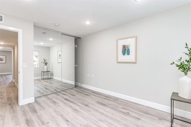 4014 Calle Sonora Oeste Unit 2B, Laguna Woods, CA 92637 - unfurnished bedroom featuring wood finished floors, recessed lighting, and a closet